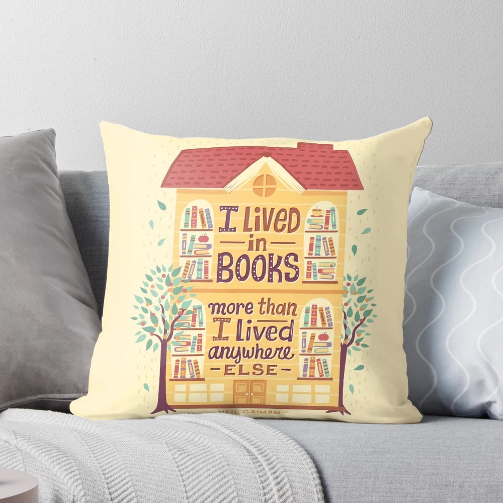 A decorative pillow with the words "Lived in Books" hand-lettered on a book-themed background, perfect for bookworms and readers.