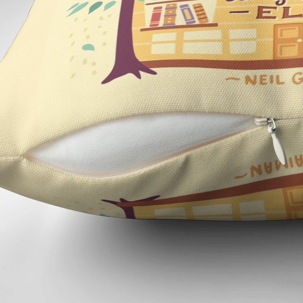 A decorative pillow with the words "Lived in Books" hand-lettered on a book-themed background, perfect for bookworms and readers.