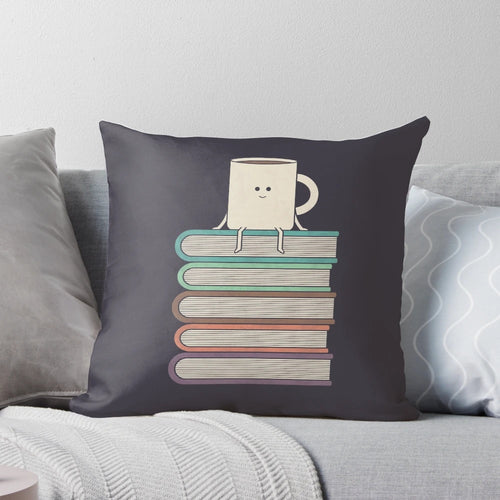 "Soft, plush pillow with a book-themed design, perfect for book lovers and readers"