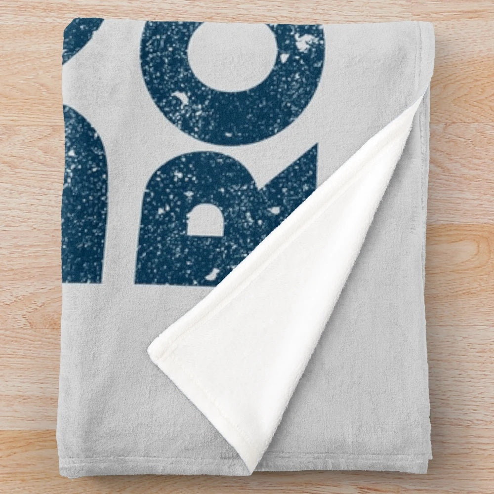 Plush blanket featuring a Michael Scott "Boom. Roasted." design inspired by the TV show The Office.