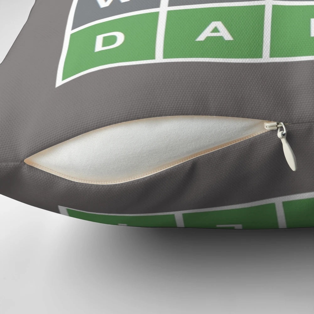 Colorful pillow featuring a Wordle-style game grid with letters