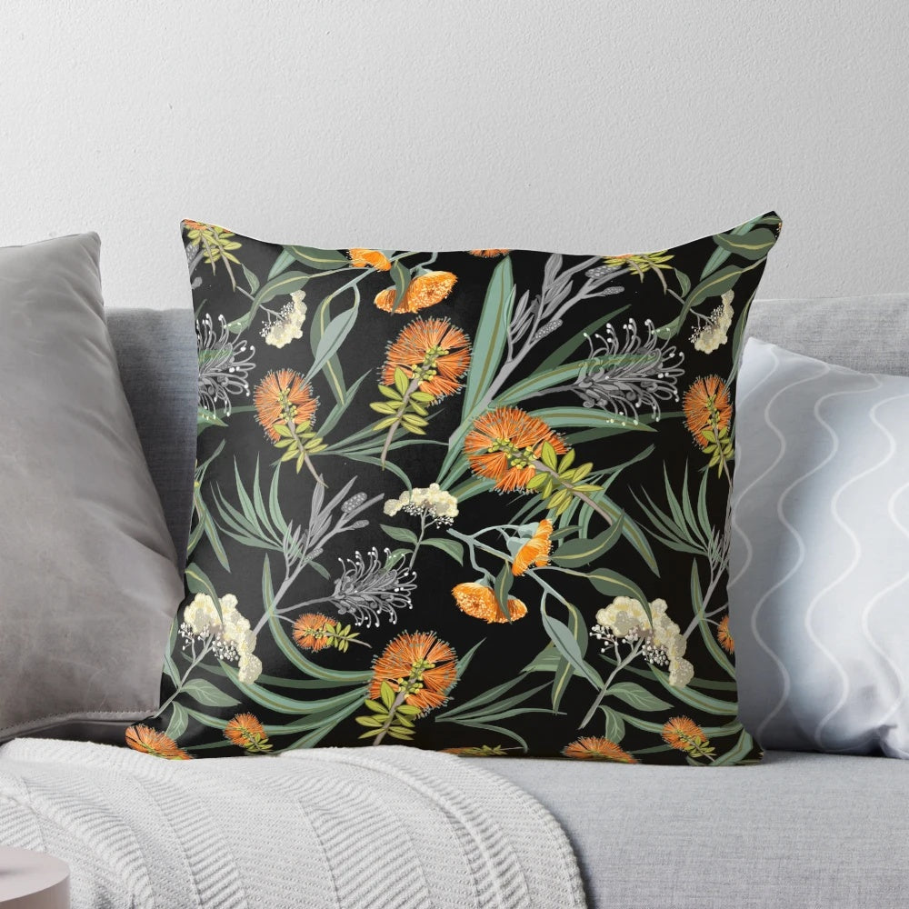 Botanical pillow featuring an orange and white pattern of Australian native banksia flowers and foliage.