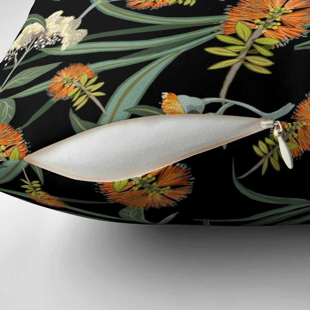 Botanical pillow featuring an orange and white pattern of Australian native banksia flowers and foliage.