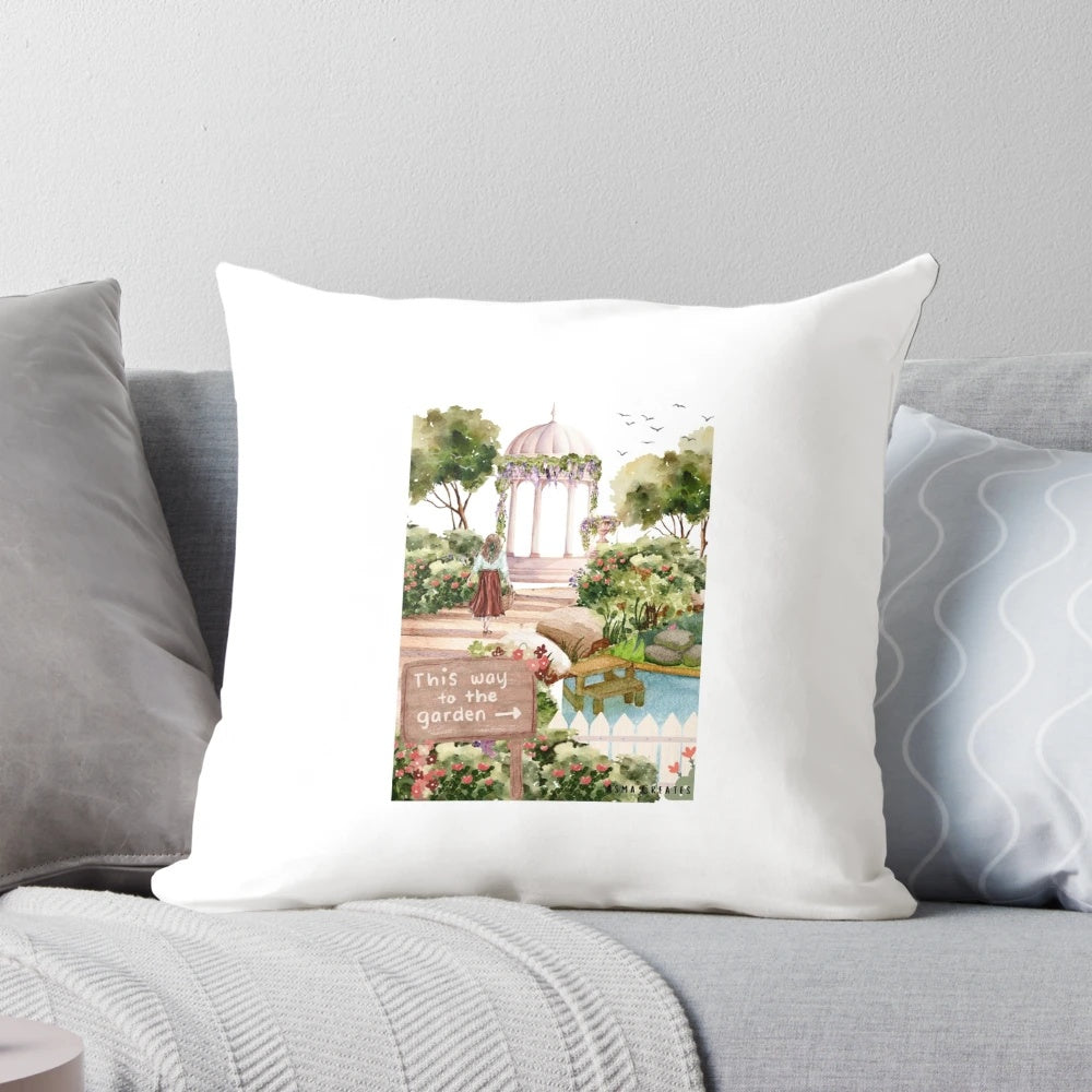 Decorative throw pillow featuring a watercolor painting of a birdcage in a lush garden setting