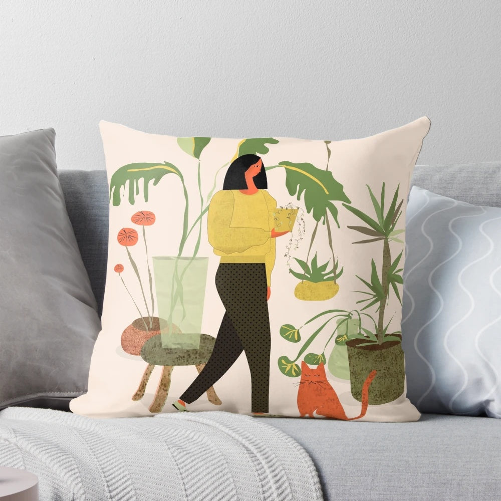 A cozy plant-themed pillow featuring a ginger cat lounging amidst a lush floral arrangement.