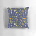 Beautifully detailed pillow featuring a charming illustration of bees pollinating vibrant wildflowers against a dark blue background.