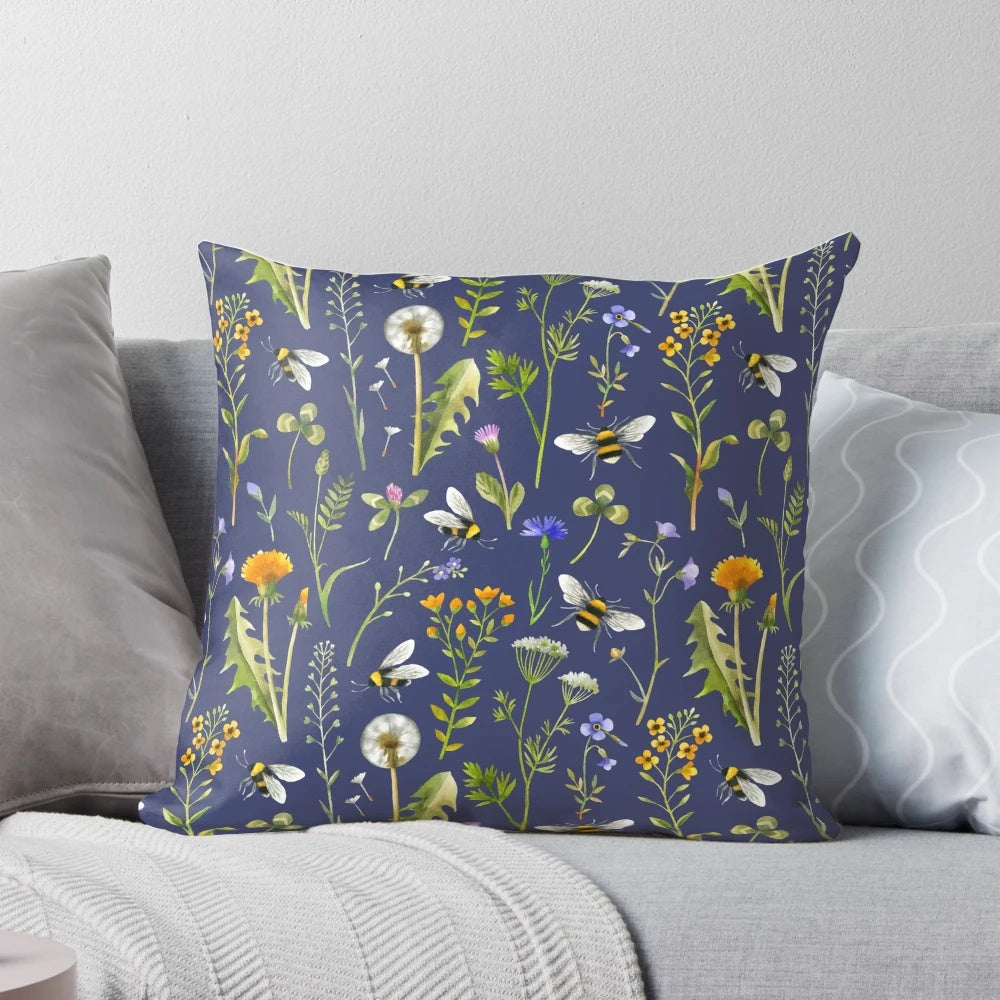 Beautifully detailed pillow featuring a charming illustration of bees pollinating vibrant wildflowers against a dark blue background.