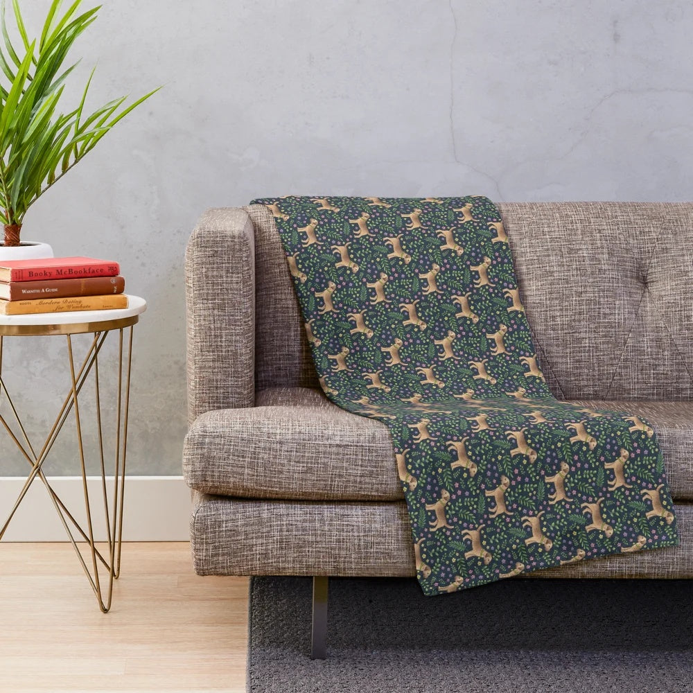 Plush blanket featuring a hand-drawn border terrier in a botanical floral pattern on a navy background