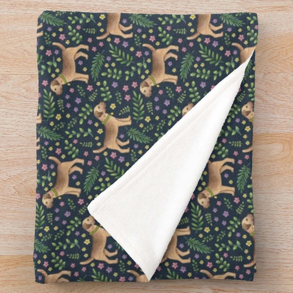 Plush blanket featuring a hand-drawn border terrier in a botanical floral pattern on a navy background