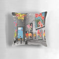 A beautiful collage-style pillow featuring a natural history museum theme with pink and black and white flowers, roses, and lilies.