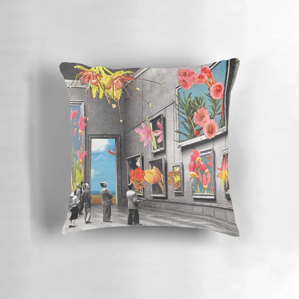 A beautiful collage-style pillow featuring a natural history museum theme with pink and black and white flowers, roses, and lilies.
