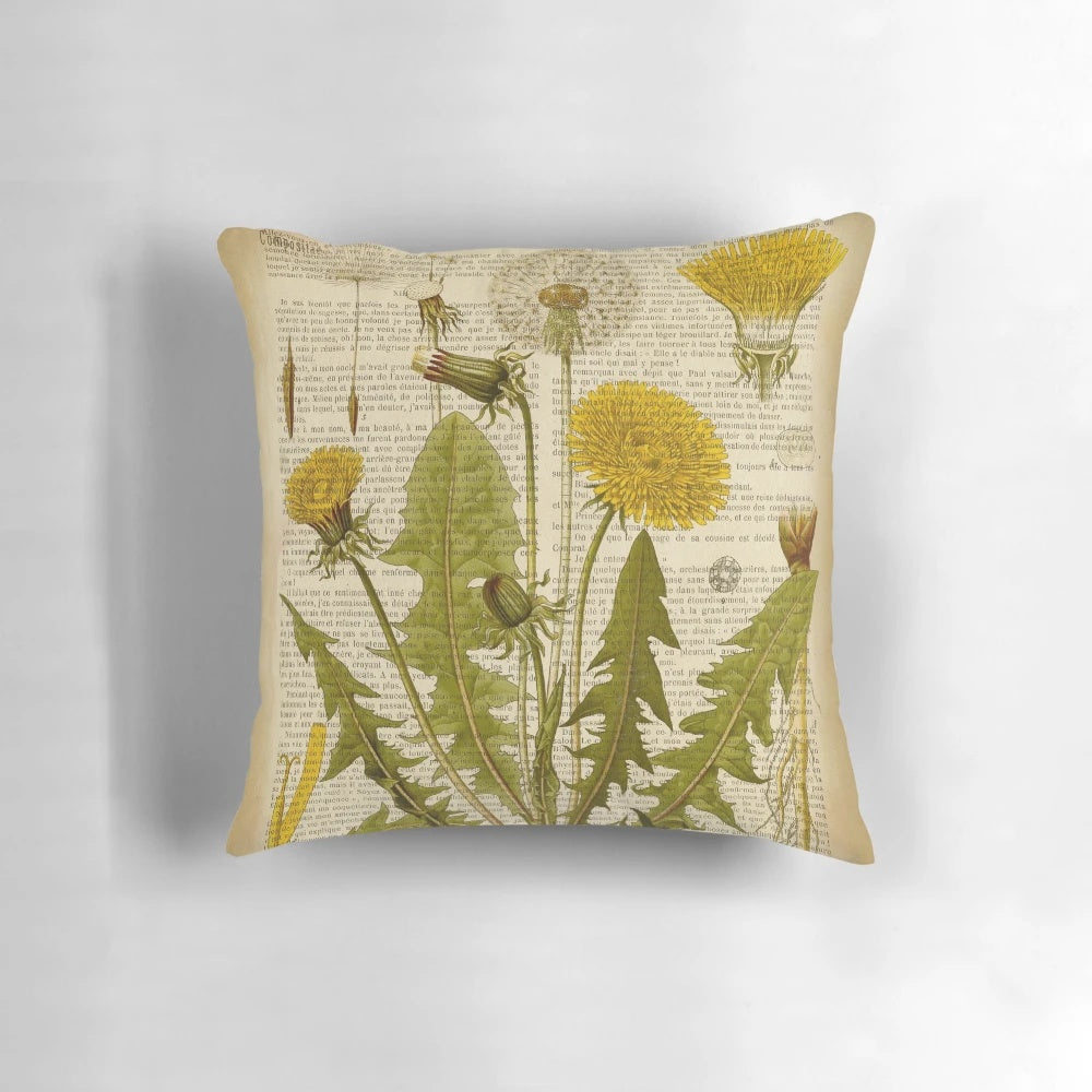 Pillow featuring a botanical print of dandelion flowers on an aged, vintage book page.