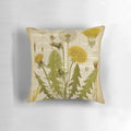 Pillow featuring a botanical print of dandelion flowers on an aged, vintage book page.