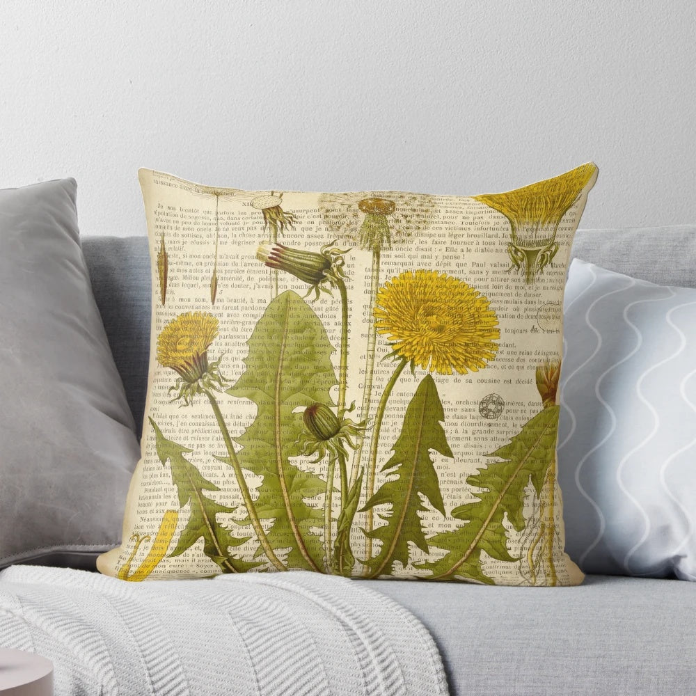 Pillow featuring a botanical print of dandelion flowers on an aged, vintage book page.