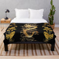 Plush blanket with digital illustration of a dragon, egret, lotus flowers, and green gold floral patterns