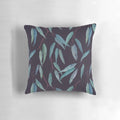 Closeup of a pillow covered in eucalyptus leaves, creating a serene and natural look.
