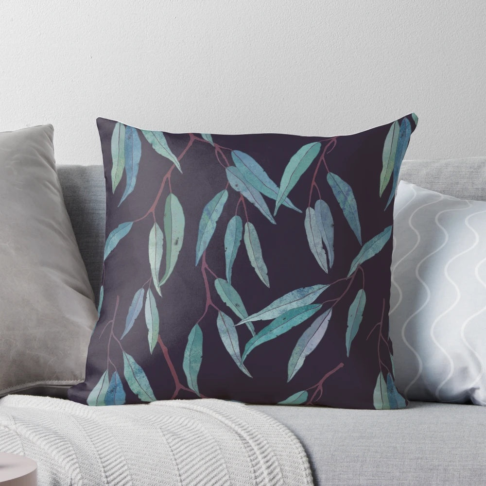 Closeup of a pillow covered in eucalyptus leaves, creating a serene and natural look.