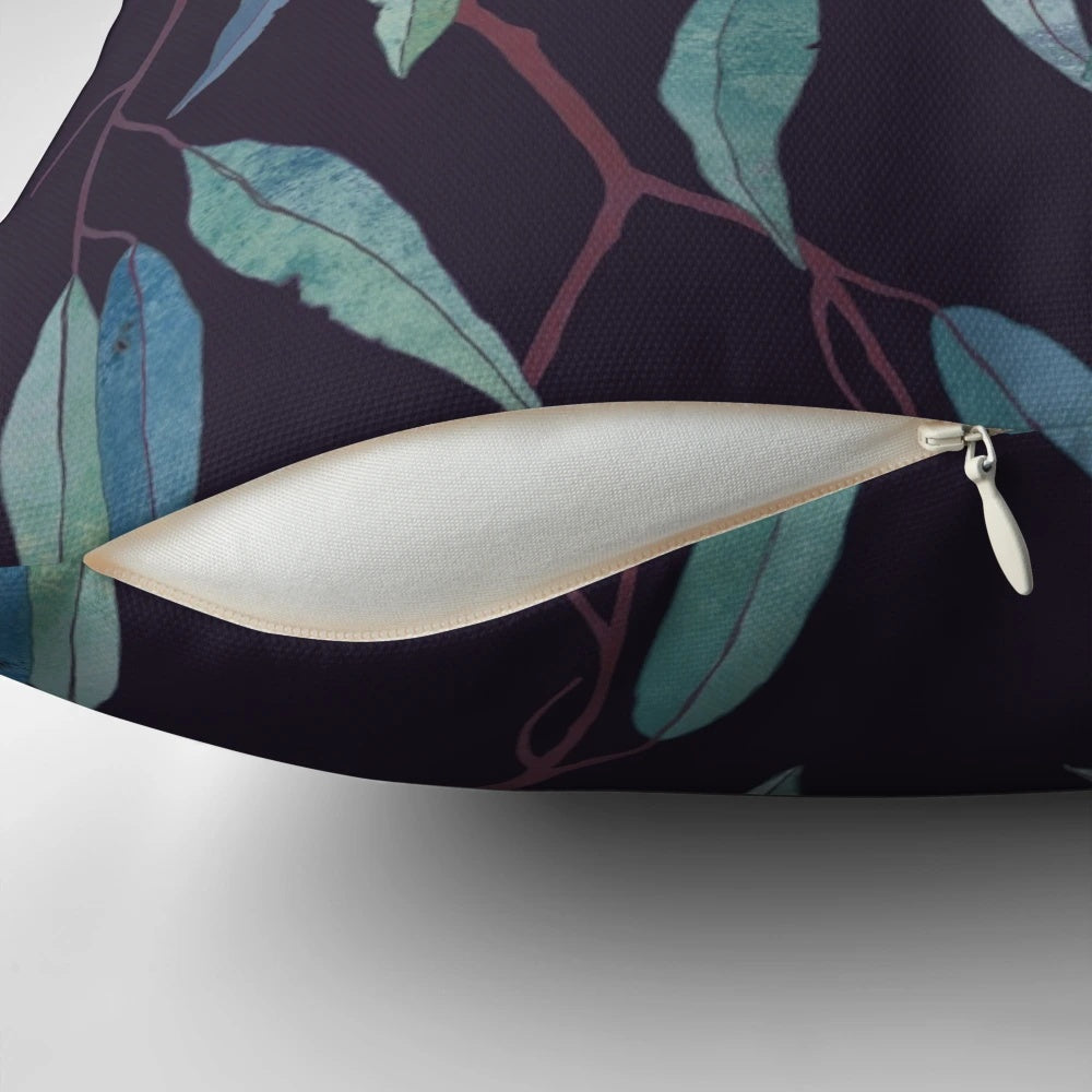 Closeup of a pillow covered in eucalyptus leaves, creating a serene and natural look.
