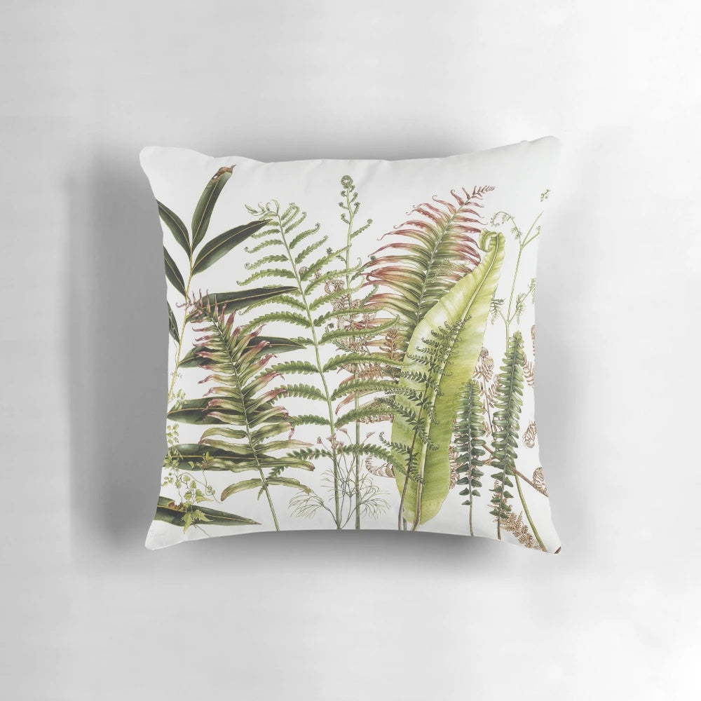 Vibrant watercolor painting of Australian ferns on a decorative throw pillow