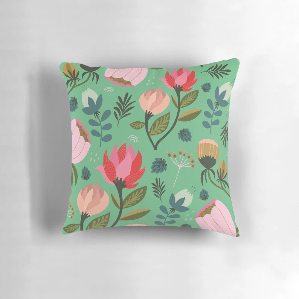 Vibrant, floral-patterned decorative pillow with botanical design