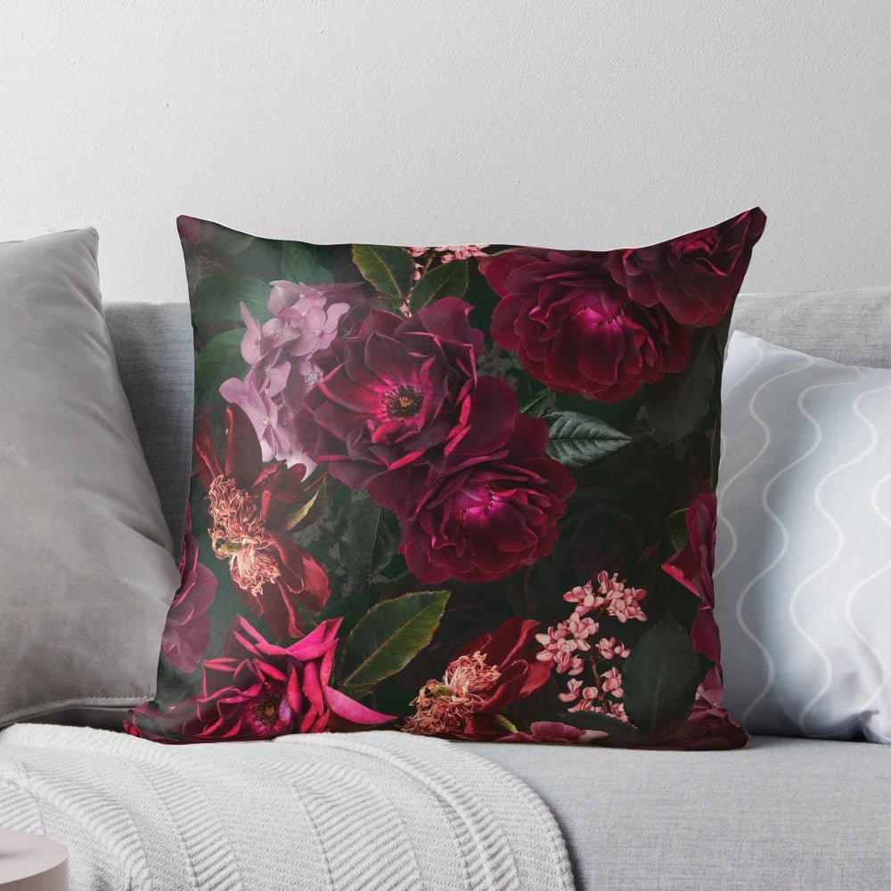 Antique-style botanical flower design on a black and white throw pillow
