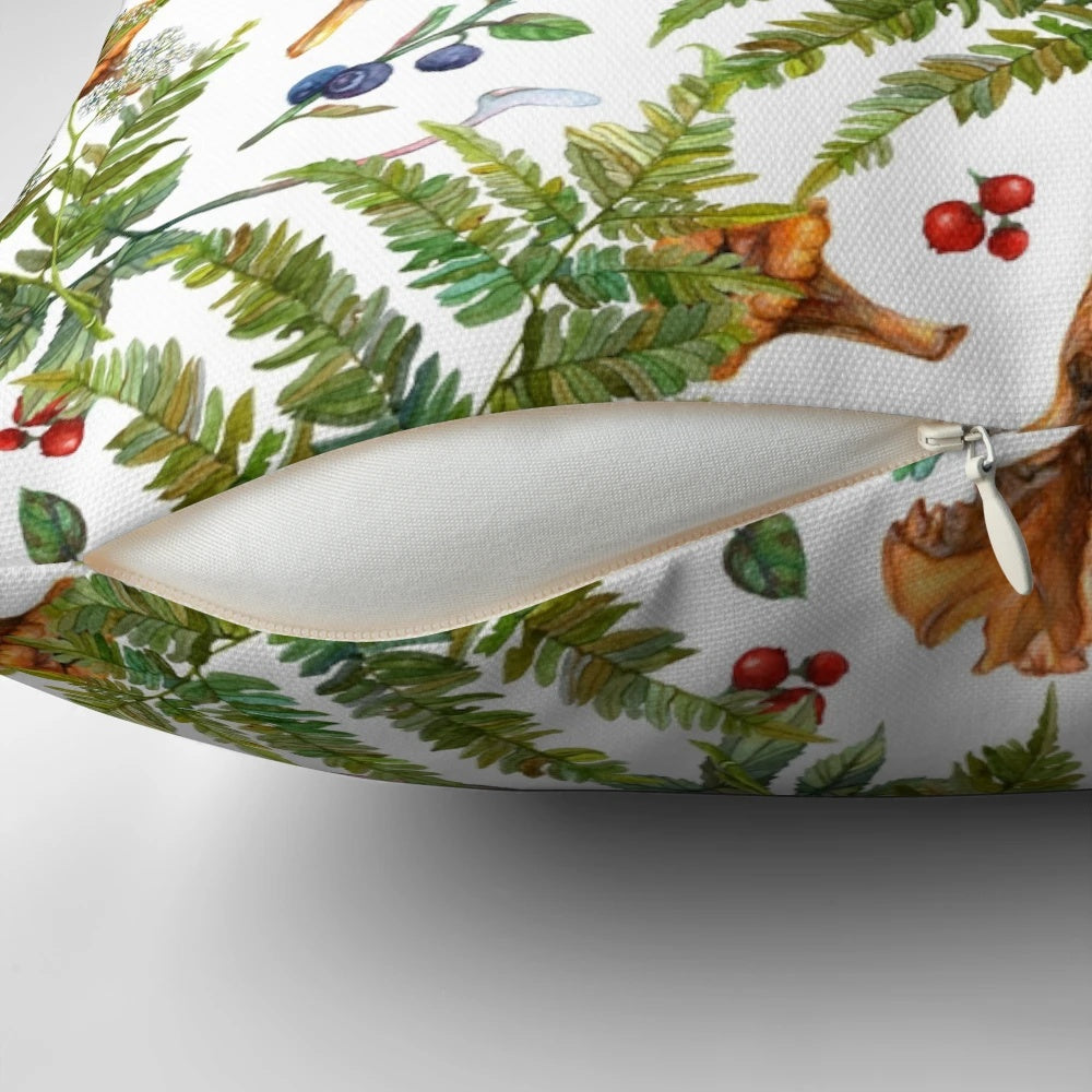 A watercolor painting of forest ferns, berries, and mushrooms on a decorative pillow.