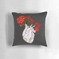 Decorative pillow featuring a detailed illustration of a human heart surrounded by delicate floral elements.