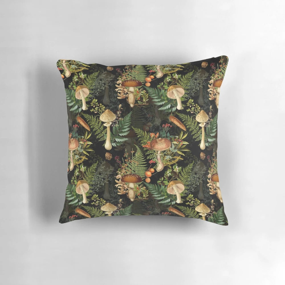 Vintage-inspired pillow featuring a botanical pattern with dark mushrooms and plants in a midnight forest scene