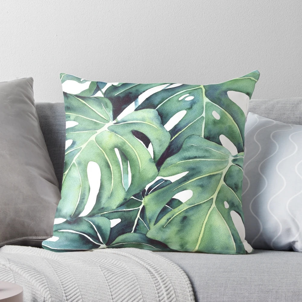 Decorative monstera plant pillow with abstract tropical leaf illustration