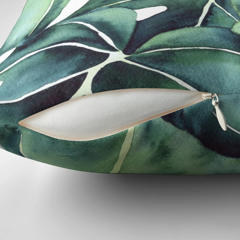 Decorative monstera plant pillow with abstract tropical leaf illustration