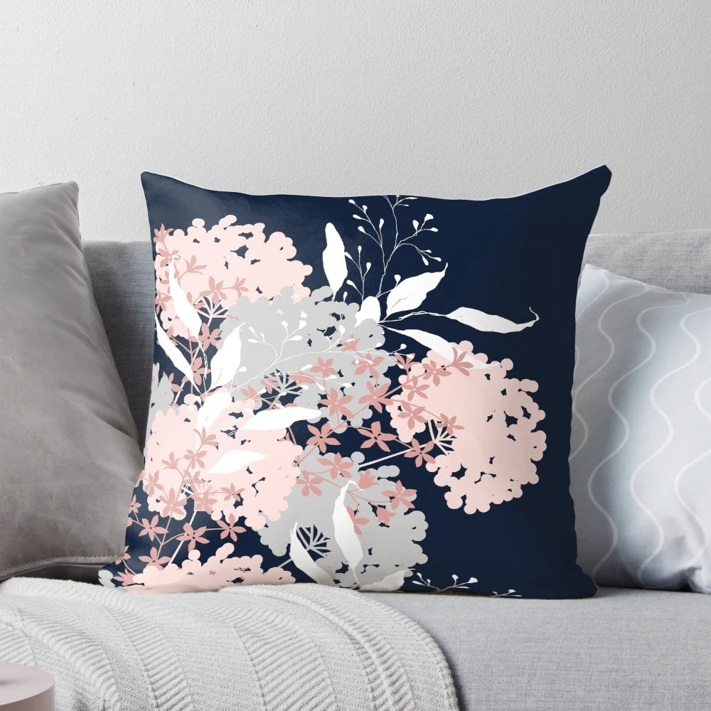 Navy blue and pink floral throw pillow featuring a botanical, abstract nature design