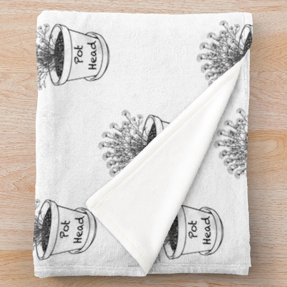 Plush blanket with a botanical cannabis/marijuana leaf design, perfect for stoners and plant lovers