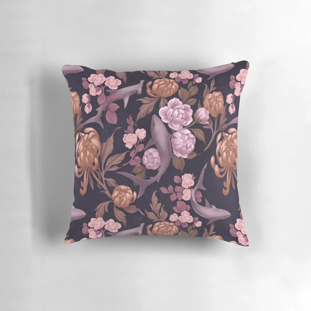 Botanical sharks and floral patterns in soft pink and rose gold colors on a decorative throw pillow.