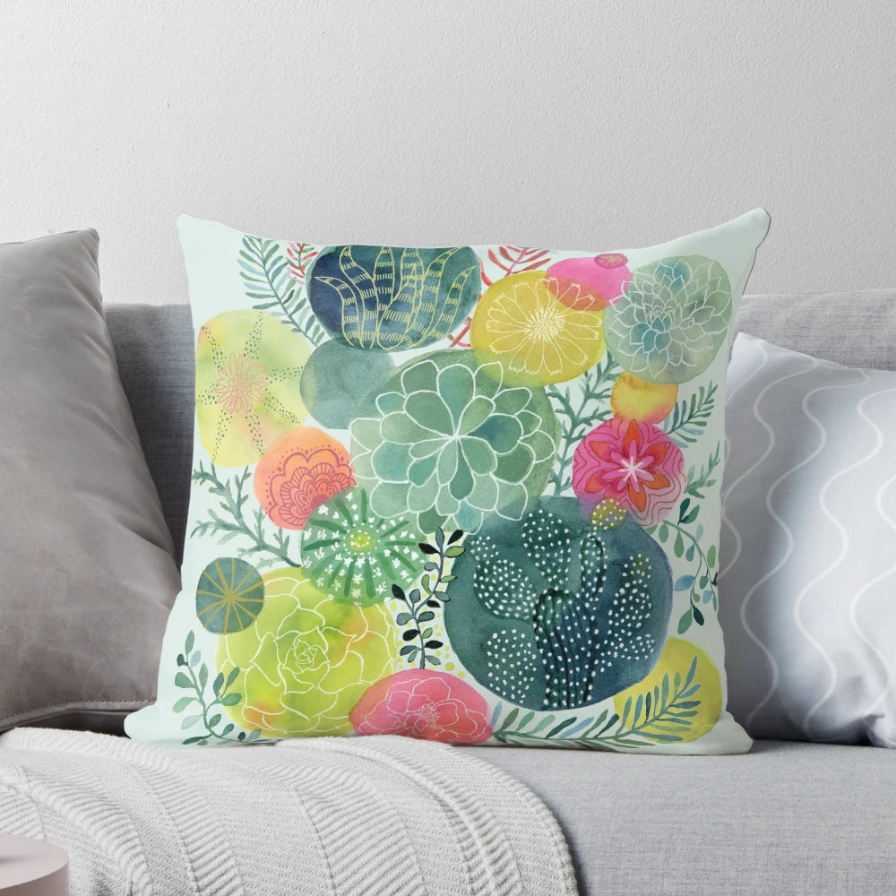 Handpainted botanical succulent circle pillow in shades of green and pink