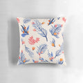 Cream-colored pillow with a vibrant succulent garden pattern in shades of blue, pink, and orange.