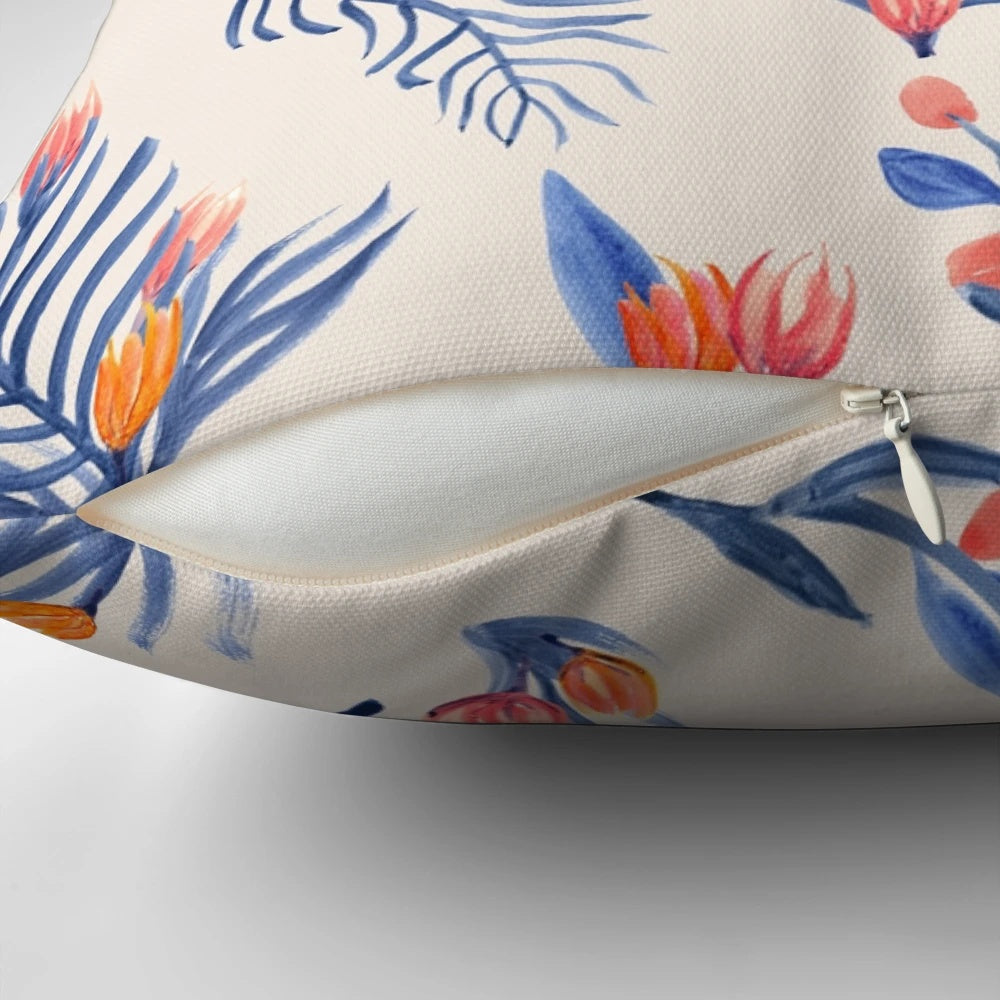 Cream-colored pillow with a vibrant succulent garden pattern in shades of blue, pink, and orange.