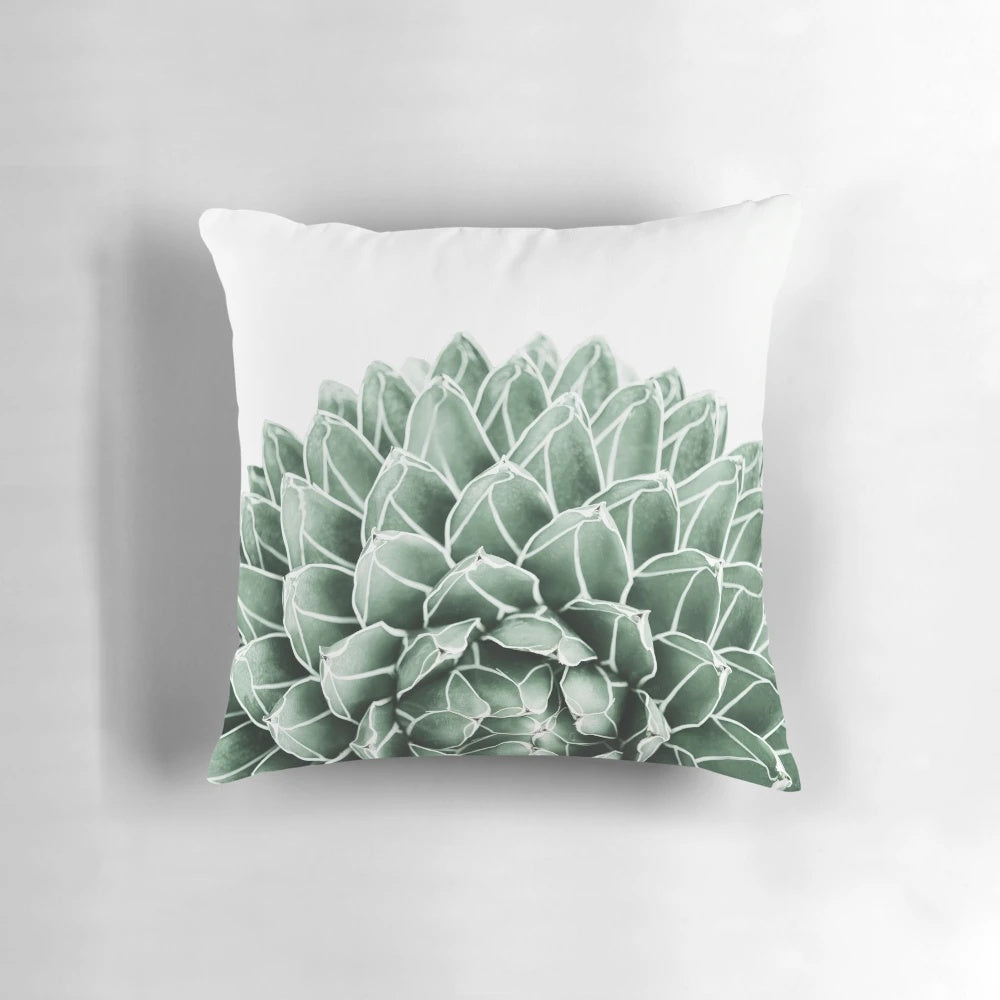 Lush green and neutral-toned succulent and botanical design on a soft, cozy pillow