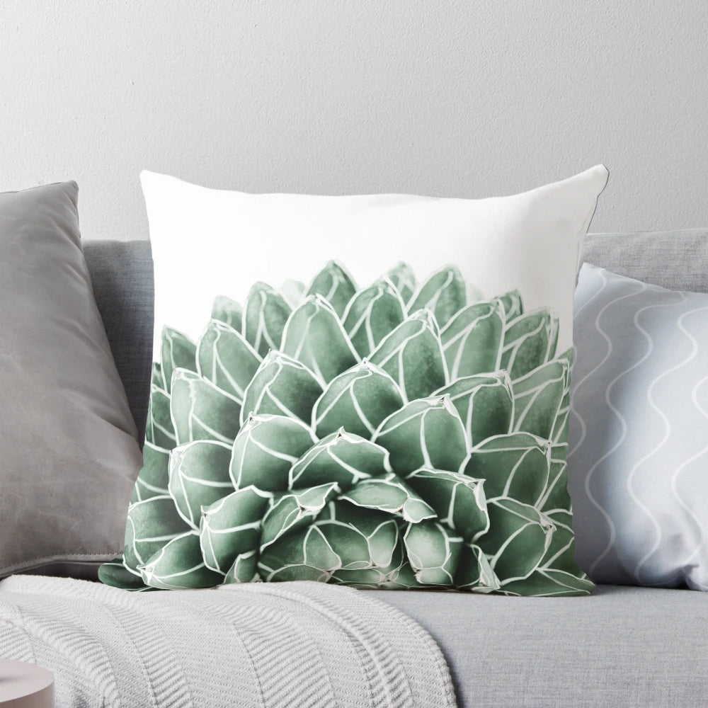 Lush green and neutral-toned succulent and botanical design on a soft, cozy pillow