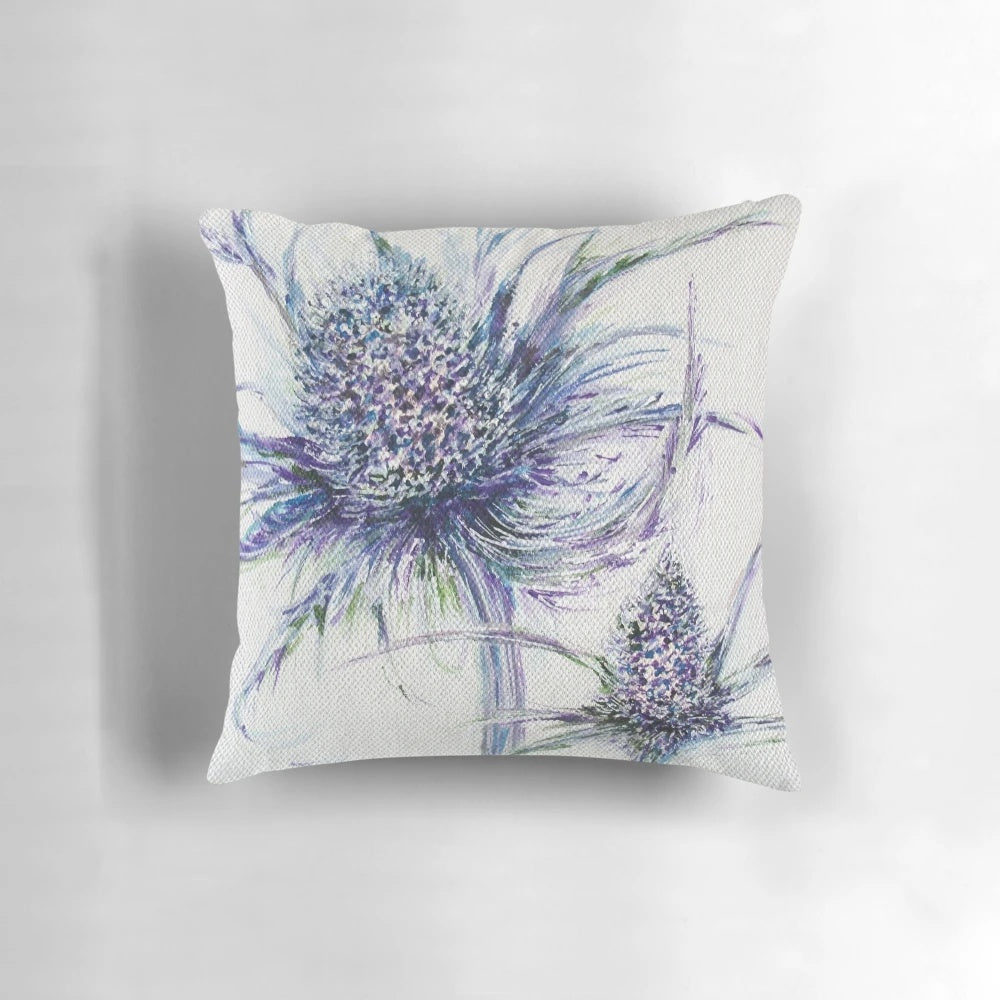 A decorative throw pillow featuring a wild thistle design, perfect for nature-inspired home decor.