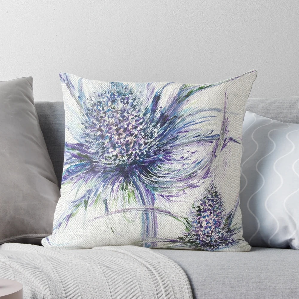 A decorative throw pillow featuring a wild thistle design, perfect for nature-inspired home decor.