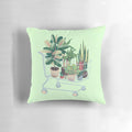 A vibrant and nature-inspired pillow featuring lush foliage, leaves, and botanical elements.