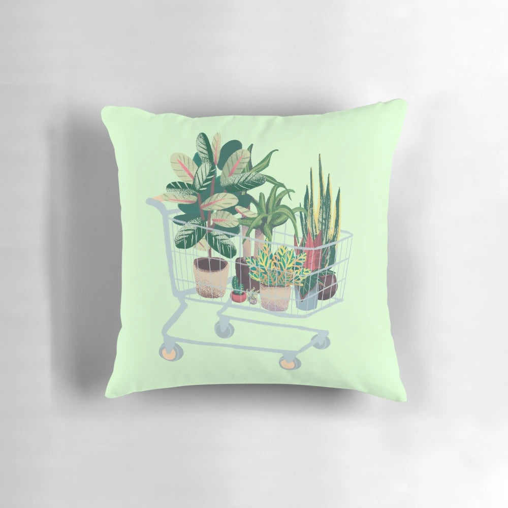 A vibrant and nature-inspired pillow featuring lush foliage, leaves, and botanical elements.