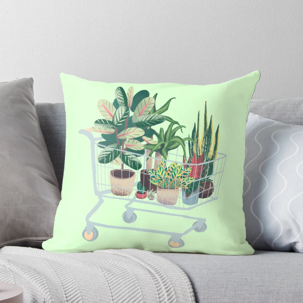 A vibrant and nature-inspired pillow featuring lush foliage, leaves, and botanical elements.