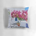 Bougainvillea Bloom Pillow with Vibrant Purple and Pink Flowers Against a Scenic Greek Island Background