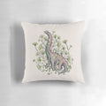 Brachiosaurus sauropod dinosaur surrounded by ginkgo leaves in a watercolor botanical art design on a decorative throw pillow.