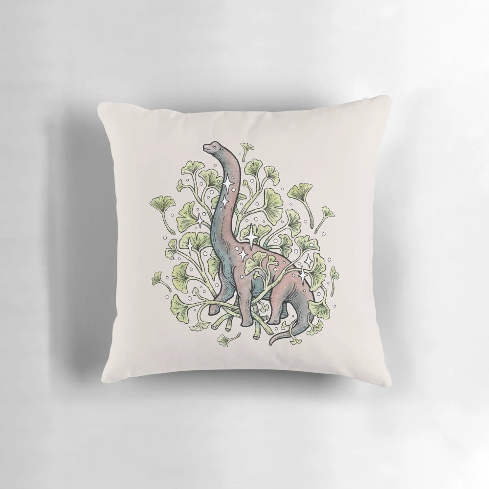 Brachiosaurus sauropod dinosaur surrounded by ginkgo leaves in a watercolor botanical art design on a decorative throw pillow.