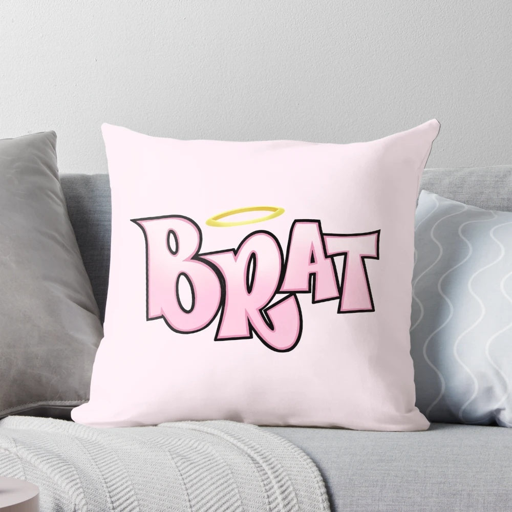 Bratz-inspired pink and magenta pillow with a sarcastic, angel-halo logo design for a cute, aesthetic bedroom.