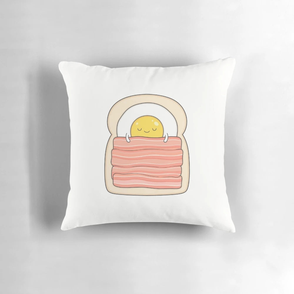 Breakfast-themed pillow with bacon, eggs, and toast design