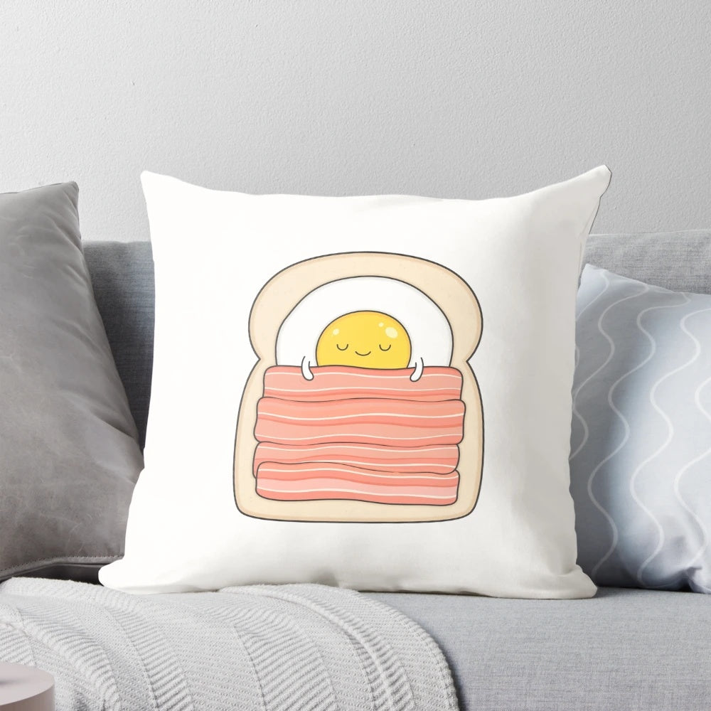 Breakfast-themed pillow with bacon, eggs, and toast design