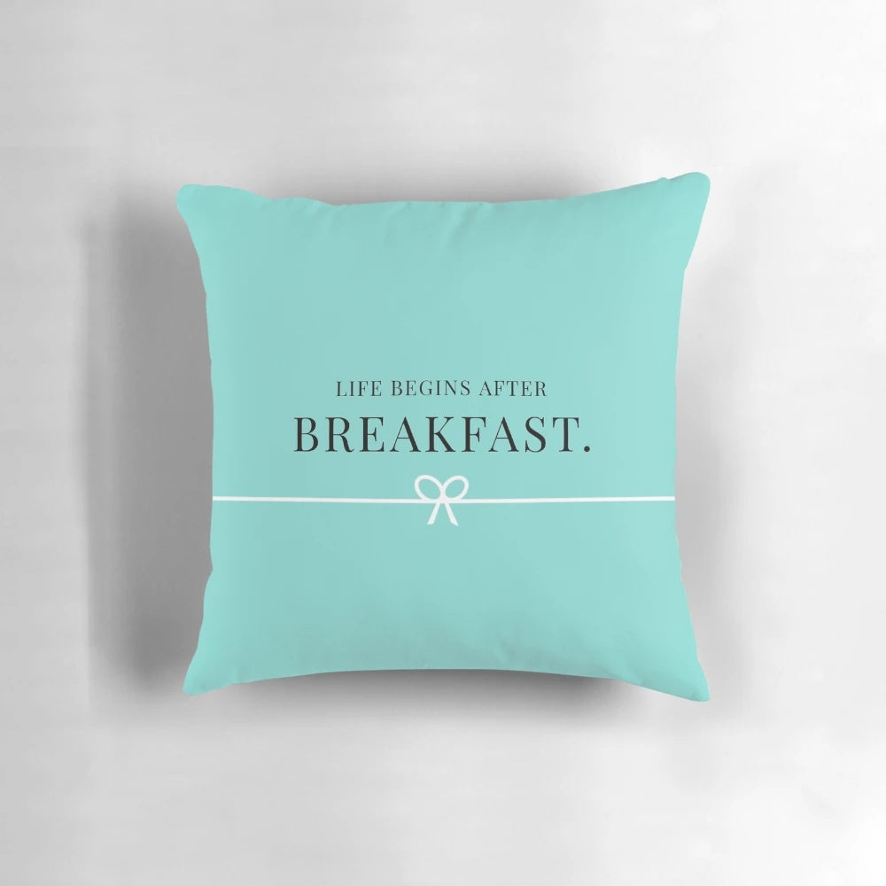 A decorative breakfast-themed pillow with a Tiffany-inspired design, perfect for adding a girly touch to any space.